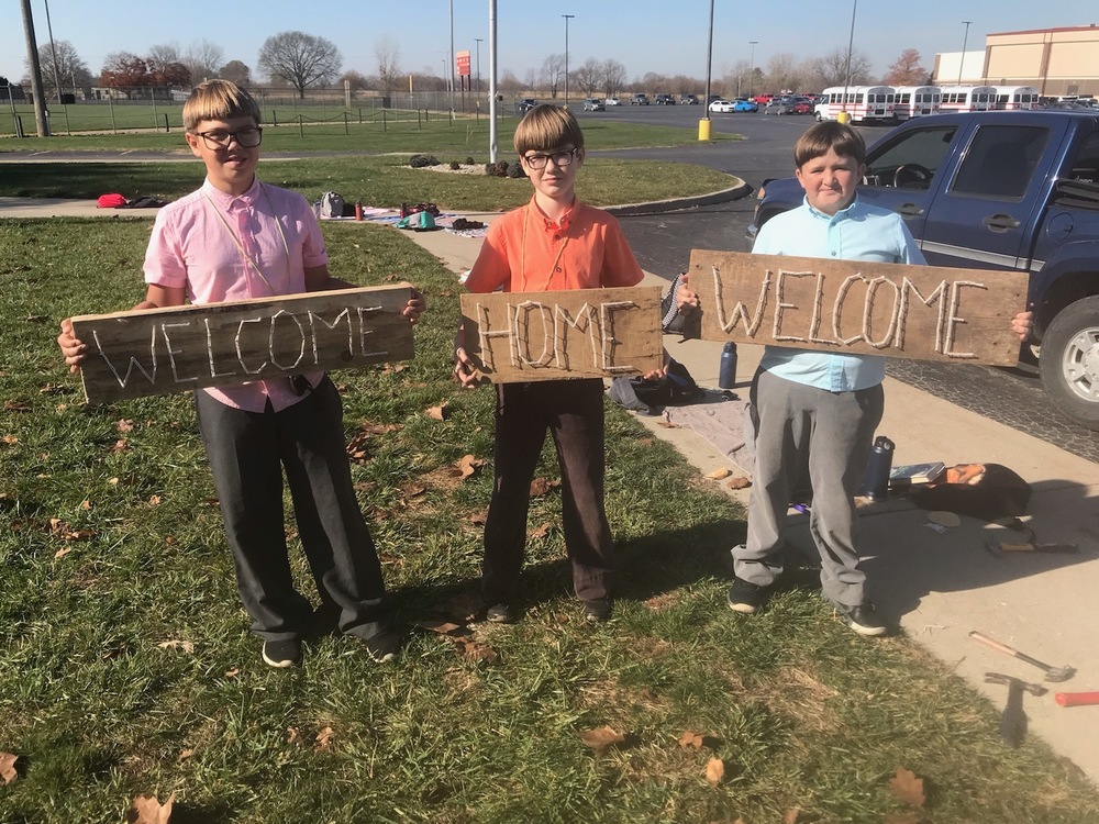 Boys from Class 5A show their projects